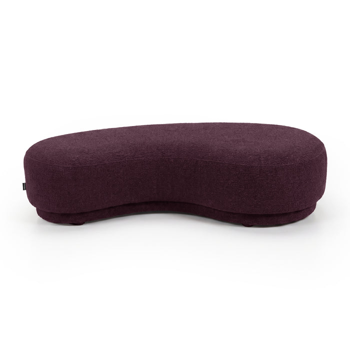 Modern bean-shaped plum upholstered bench seat on a white background