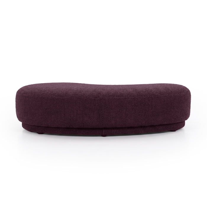 Rounded rectangular plum upholstered  bench seat on a white background