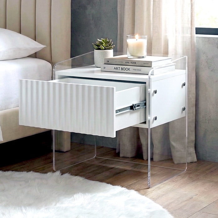 Nightstand with open drawer in bedroom setting