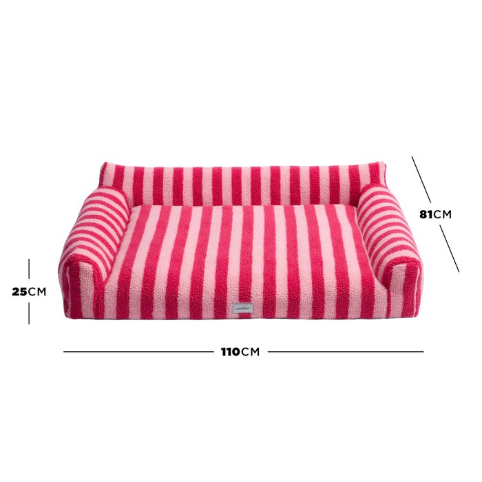 Pink striped pet bed on white background with dimension lines marking 25 cm, 81 cm, and 110 cm