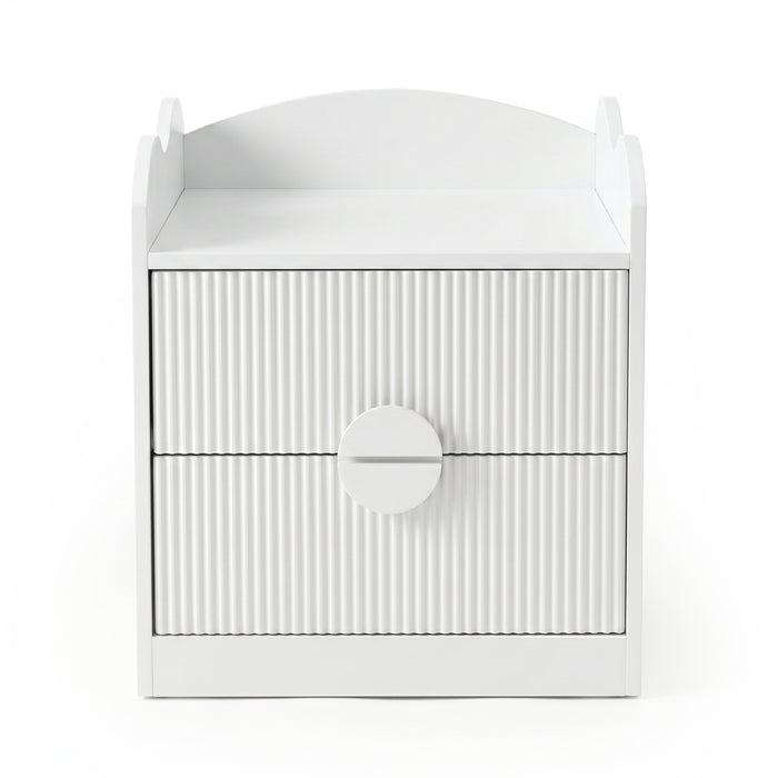 White bedside table with two drawers and oversized circular handle on white background