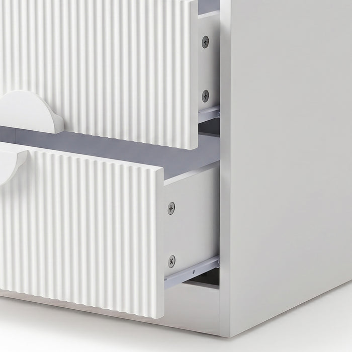 Close-up of open white drawers with visible hardware on white background