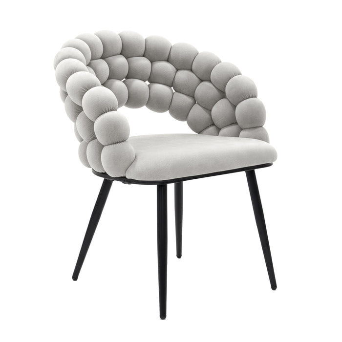 Claudine Velvet Curved Dining Chair Set of 2 in Warm Grey features bubble-style upholstered backrest and armrests, smooth seat cushion, and matte black tapered legs, blending contemporary design with comfort.