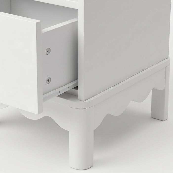 Close-up of nightstand side and open drawer on white background