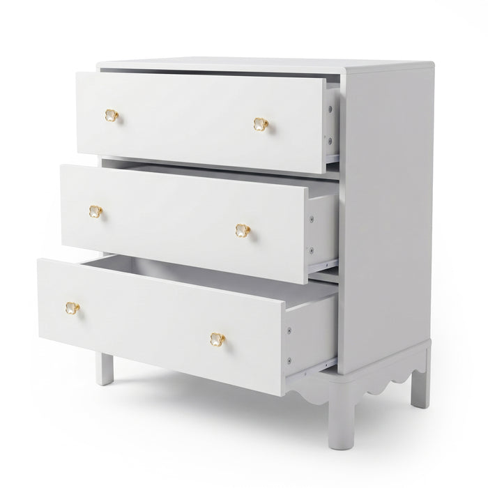 White three-drawer dresser with gold flower knobs on white background