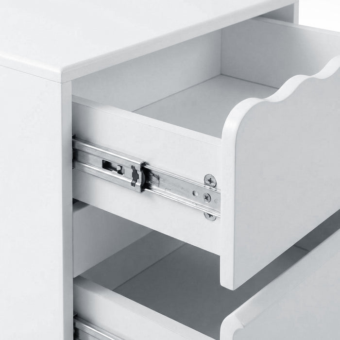 Close-up of drawer sliding mechanism inside white nightstand