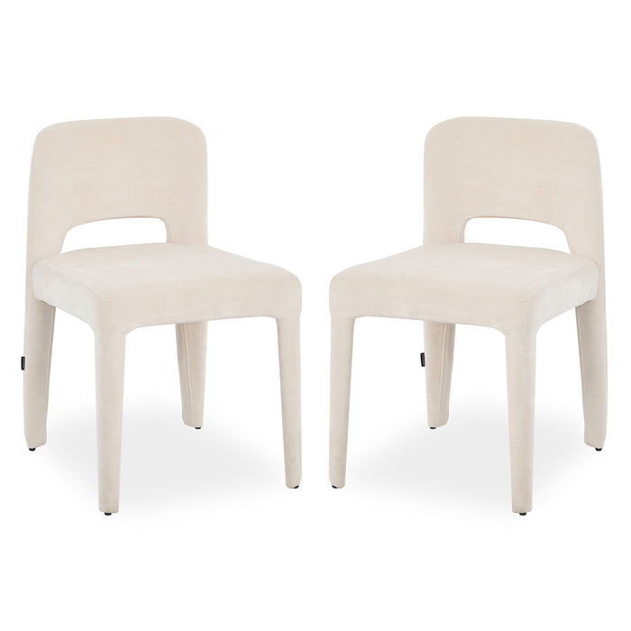 Two Edris upholstered dining chairs in oat fabric with curved backrest cutout and tapered legs
