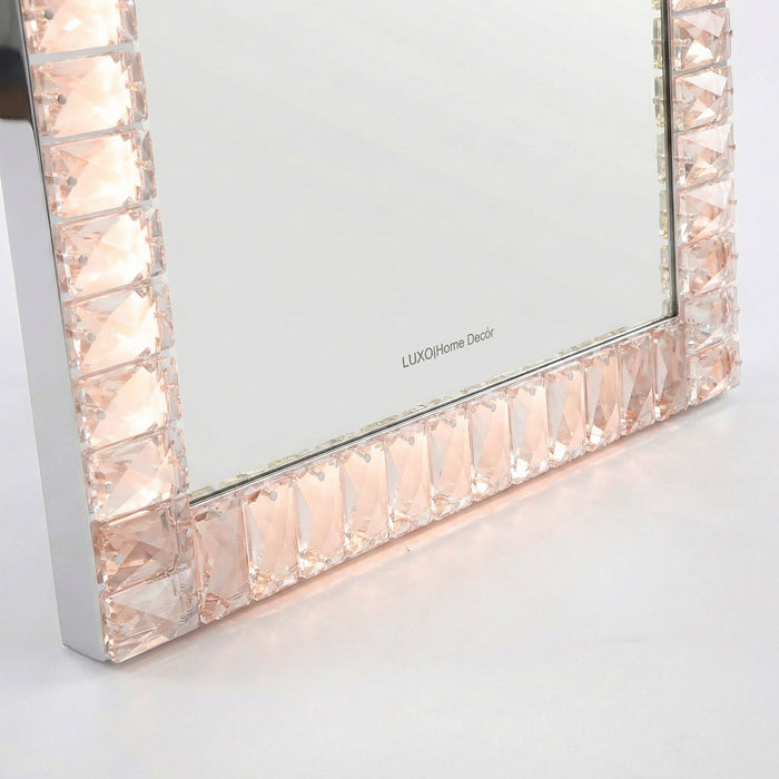 Close-up of faceted gem-like mirror frame detail