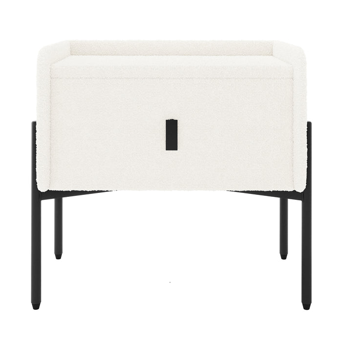 Eliz Boucle Fabric Bedside Table in Cream White, featuring a cuboid shape with boucle upholstery, a centered drawer with black pull, and sleek black metal legs, embodying contemporary elegance.