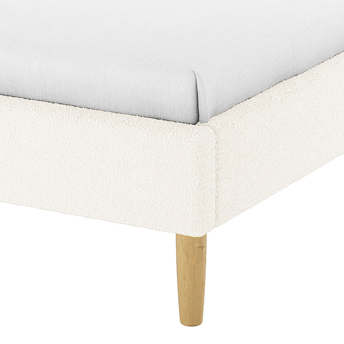 Close-up of the Estilla Single Rainbow Boucle Bed Frame in Cream White, showcasing its light boucle-style upholstered corner and wooden leg, emphasizing its cosy and whimsical design for kids or guest rooms.