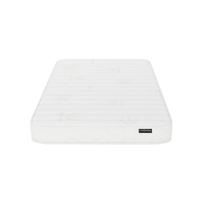 Gettel 10cm High-Density Foam Knitted Nursery Cot Mattress features a quilted cover with subtle stitched patterns and faint leaf motifs; visible LUXO bedding tag enhances its distinct design.