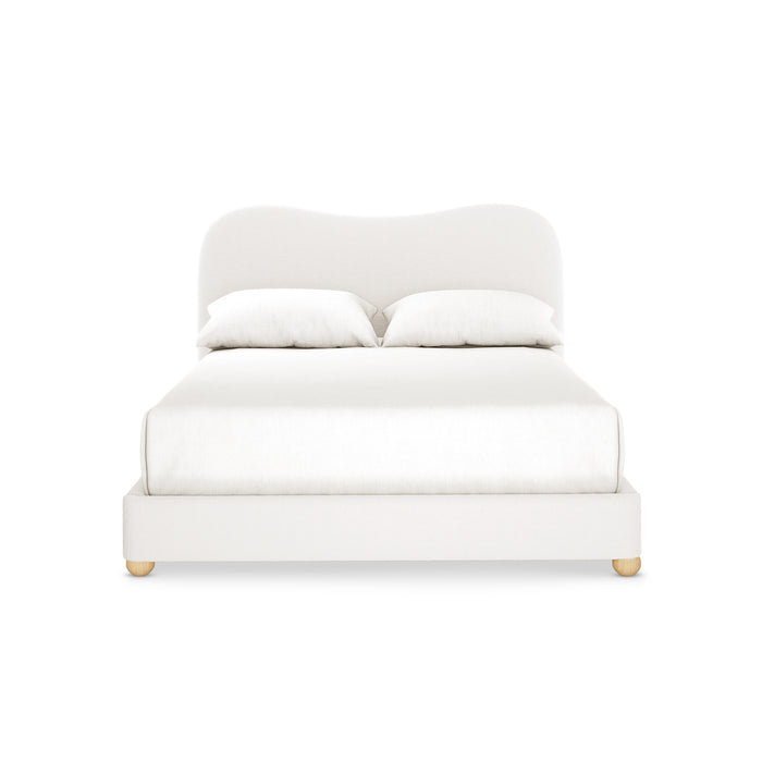 Ginnie Bouclé Curved Double Bed Frame features a low-profile upholstered frame with a plush curved headboard, two white pillows, and wooden bun feet, ideal for modern, compact bedroom spaces.