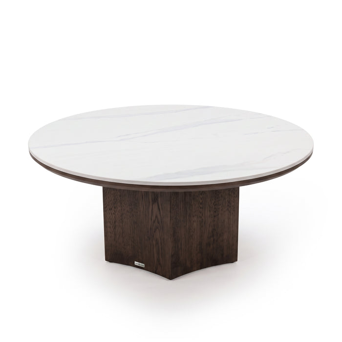 Round table with white marble-like tabletop and dark wooden pedestal base isolated on a white background.