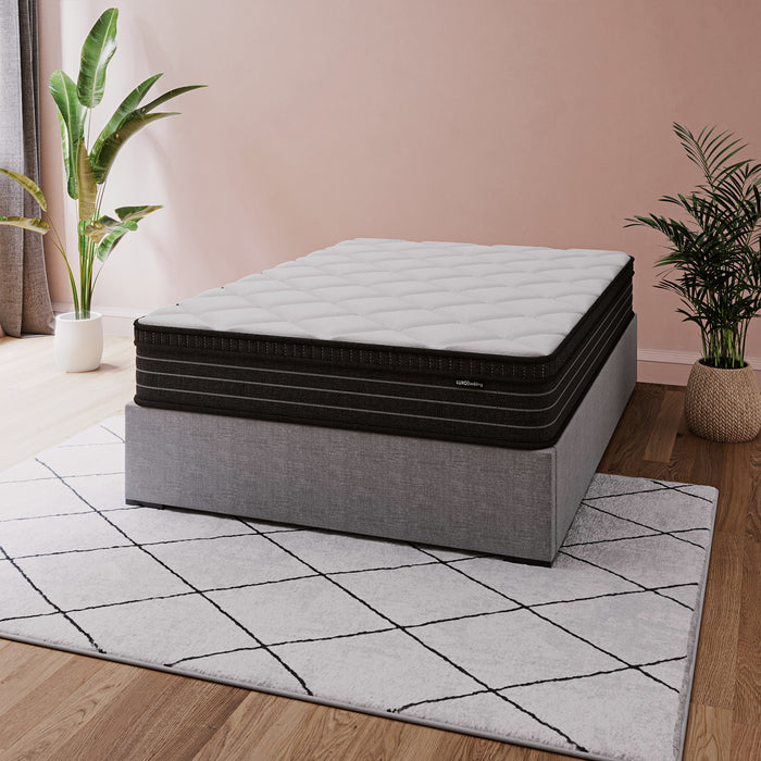 Iris Double Firm 25cm foam pillow top pocket spring mattress with quilted white top and black base on grey bed frame
