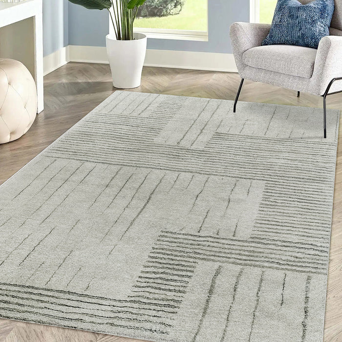 Jabeza Soft Contemporary Printed Rug 160x230cm on a floor, showcasing its soft 12mm pile and modern design. The rug's anti-slip backing ensures stability, ideal for enhancing comfort in any room.