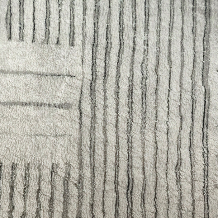 Jabeza Soft Contemporary Printed Rug 160x230cm features an abstract sketch design with a soft 12mm pile, ideal for modern interiors. Enhanced with durable polyester and anti-slip backing for stability and comfort.