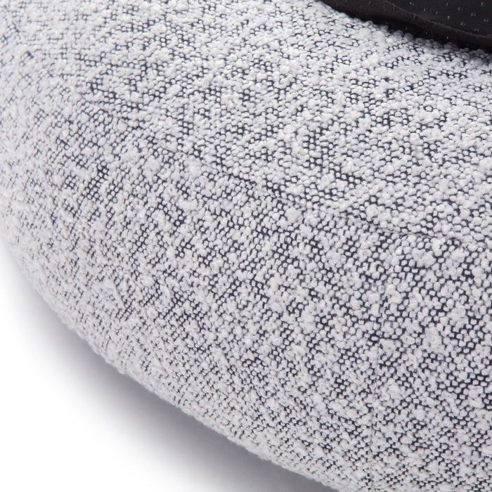 Kyra Medium Boucle Pet Bed – White with Black Base showcasing close-up of textured boucle fabric with visible stitches, highlighting plush support and ergonomic raised bolsters for pet comfort.