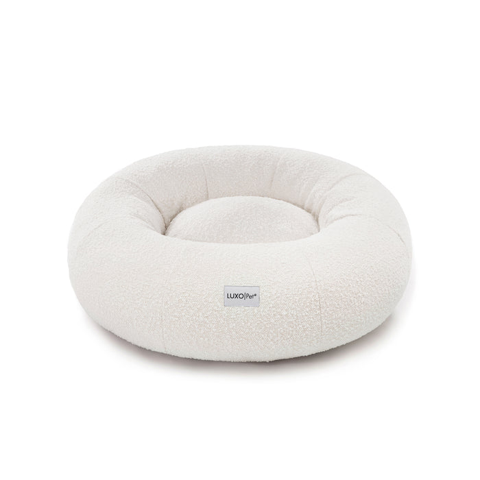 Kyra Medium Boucle Pet Bed – Light Beige Comfort, features soft, raised bolsters and plush boucle fabric, designed for ergonomic pet support and modern style, with a smooth, non-slip base.
