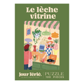 Illustration of people admiring a vibrant shop window; text: Le Lèche Vitrine, Jour Férié. Features a 100-piece jigsaw puzzle by Jour Férié, with an elegant ribbon cut design, made in France.
