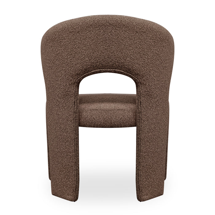 Lunari Bouclé Curved Accent Chair in Brown features a sculptural design with a curved backrest, central cut-out, and U-shaped legs, upholstered in soft bouclé fabric for modern elegance.