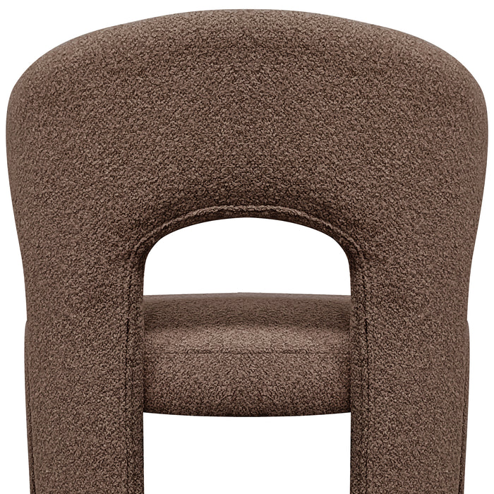 Lunari Bouclé Curved Accent Chair in Brown features a textured fabric, rounded backrest with cut-out, and padded seat, embodying comfort and style for modern spaces.