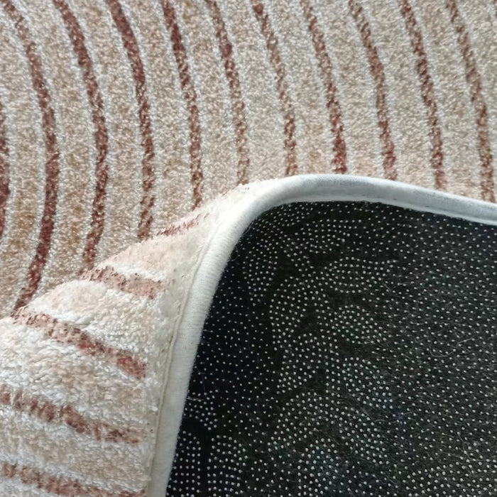 The Lunder 200x300cm Modern Abstract Floor Rug features a beige pile with rust-colored stripes and a non-slip black backing, ideal for enhancing décor and protecting floors.