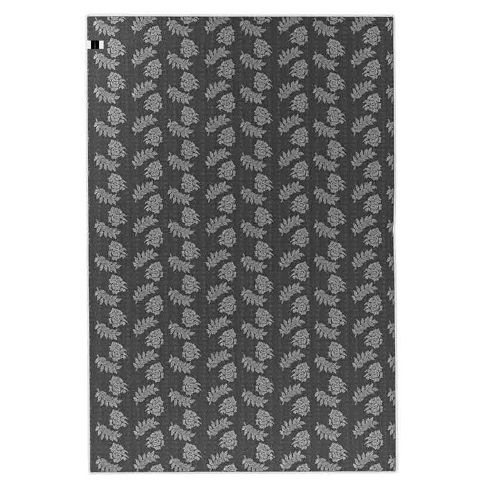 Melody Black & White Modern Rug 120x170cm showcases a Scandinavian-inspired design with black abstract lines on an ivory backdrop, ideal for complementing vibrant furniture in living or dining areas.