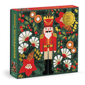 The Galison Merry Nutcracker | 500 Piece Jigsaw Puzzle features a festive nutcracker with flowers on a green background and comes in a holiday-themed box accented with elegant gold foil.