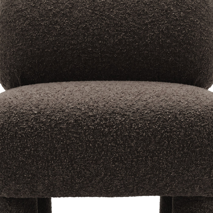Detail of boucle upholstery on chair seat and backrest