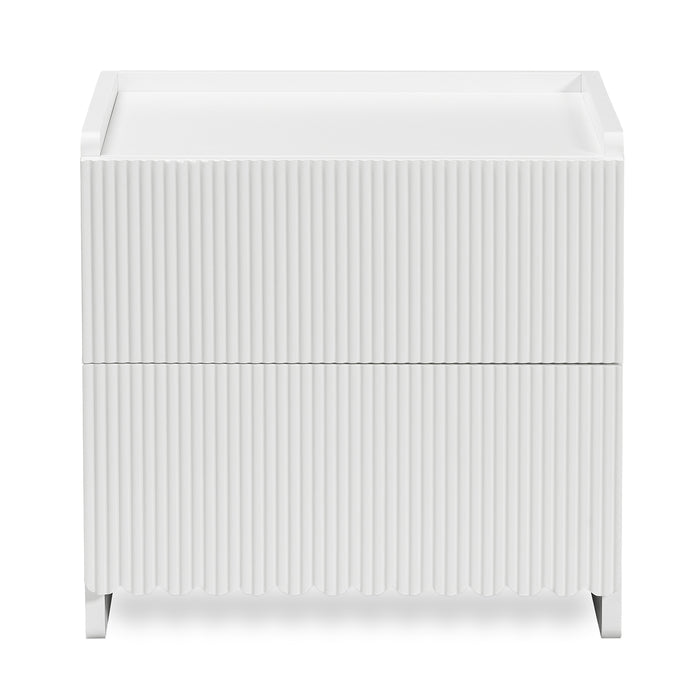 Nasrin 2 Drawer Bedside Table in White, featuring a matte finish, vertical ribbed drawer fronts, low-lip top surface, and short legs, offering modern elegance and functionality.