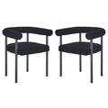 Ohio Curved Boucle Dining Chair Set of 2 in Black features low, rounded backrests and tubular armrests upholstered in black bouclé fabric, supported by sleek black metal legs for a modern look.