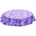 freckled sage round day of the dead white on purple oilcloth tablecloth