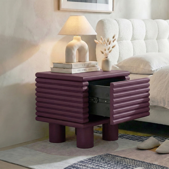 Burgundy ribbed nightstand in bedroom with open drawer