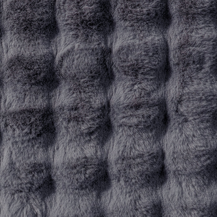 Close-up of the Severa 180x300cm Fluffy Fur Textured Bubble Rug Grey, showcasing its plush, faux-fur texture with individual fibers visible, emphasizing the luxurious and cosy appearance.
