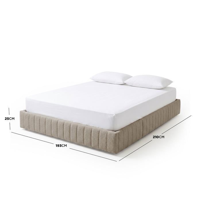 Solin King fluted storage bed base in warm beige boucle, 193cm x 210cm x 25cm, shown with mattress and pillows