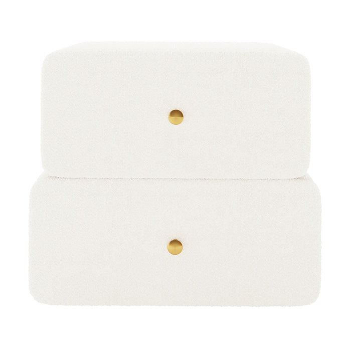 Tyla Boucle Bedside Table in Cream White, features a minimalist two-tier design with textured bouclé upholstery, two drawers each with a central brass-tone knob, enhancing bedroom elegance and functionality.