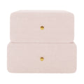 Tyla Boucle Upholstered Bedside Table in Light Pink features two soft, rounded drawers with brass knobs, wrapped in plush boucle fabric, offering a modern, elegant storage solution for bedrooms.