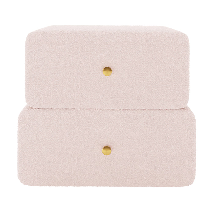 Tyla Boucle Upholstered Bedside Table in Light Pink features two soft, rounded drawers with brass knobs, wrapped in plush boucle fabric, offering a modern, elegant storage solution for bedrooms.
