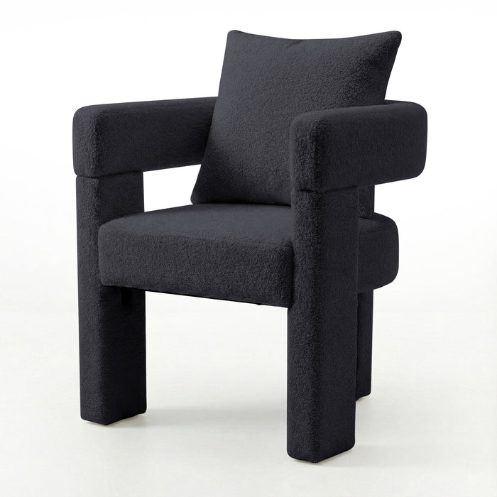 Utah Bouclé Curved 3 Legged Accent Chair in Black with plush bouclé upholstery, squared padded seat, thick tubular armrests